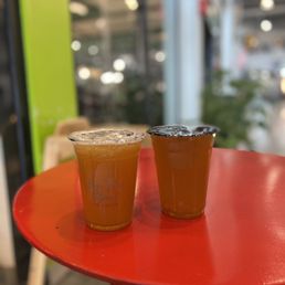 two drinks on a red table