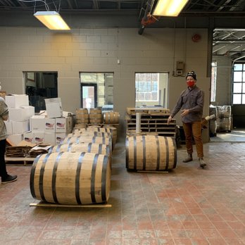 Reservoir Distillery - a man in a warehouse with barrels - Distilleries Near Me - Richmond, Virginia Reservoir Distillery - a man in a warehouse with barrels - Distilleries Near Me - Richmond, Virginia