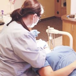 Riggs Family Dental - Chandler - Dental hygienist explaining sedation options to patient at Riggs Family Dental