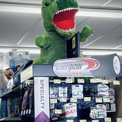 Dollar General - Dinosaur display atop one of the isle