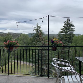 Main Street Grill - a patio with a table and chairs - Burgers Near Me - Edwards, Colorado Main Street Grill - a patio with a table and chairs - Burgers Near Me - Edwards, Colorado