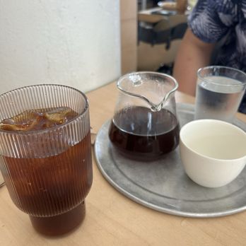 Café Regina - Left: cold brew; Right: peachy daze pour over - Coffee & Tea Near Me - San Juan, Puerto Rico Café Regina - Left: cold brew; Right: peachy daze pour over - Coffee & Tea Near Me - San Juan, Puerto Rico