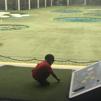 Topgolf - Even the little ones can play. My 3 y.o. grandson lining up the ball on the tee. - New American Near Me - Atlanta, Georgia Topgolf - Even the little ones can play. My 3 y.o. grandson lining up the ball on the tee. - New American Near Me - Atlanta, Georgia