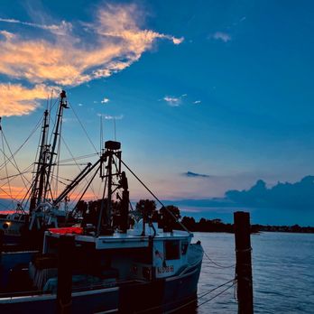 The Wharfside Patio Bar - a fishing boat docked at dusk - Bars Near Me - Point Pleasant Beach, New Jersey