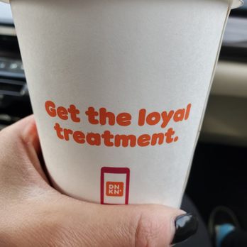Dunkin' -  a hand holding a cup of coffee - Donuts Near Me - East Setauket, New York