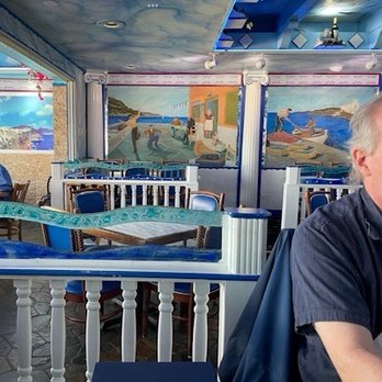 Hellas Restaurant - Some of the colorful murals that line the east wall - Bakeries Near Me - Tarpon Springs, Florida