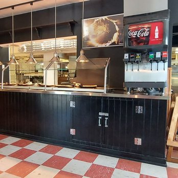 Pizzazz Pizza - a man standing at the counter - Pizza Near Me - Kitty Hawk, North Carolina Pizzazz Pizza - a man standing at the counter - Pizza Near Me - Kitty Hawk, North Carolina