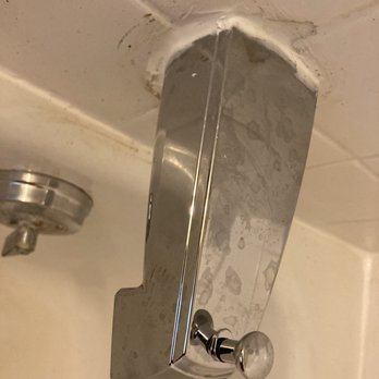 CJ Plumbing - Looks like massive caulking was used vs grout and/or tile which was cut away. - Plumbing Near Me - Waipahu, Hawaii