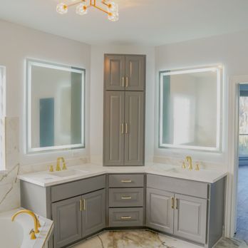 Bang it Services - Modern bathroom design with dual LED mirrors, gold fixtures, and gray cabinetry -- luxury meets functionality in every corner. - General Contractors Near Me - Houston, Texas Bang it Services - Modern bathroom design with dual LED mirrors, gold fixtures, and gray cabinetry -- luxury meets functionality in every corner. - General Contractors Near Me - Houston, Texas