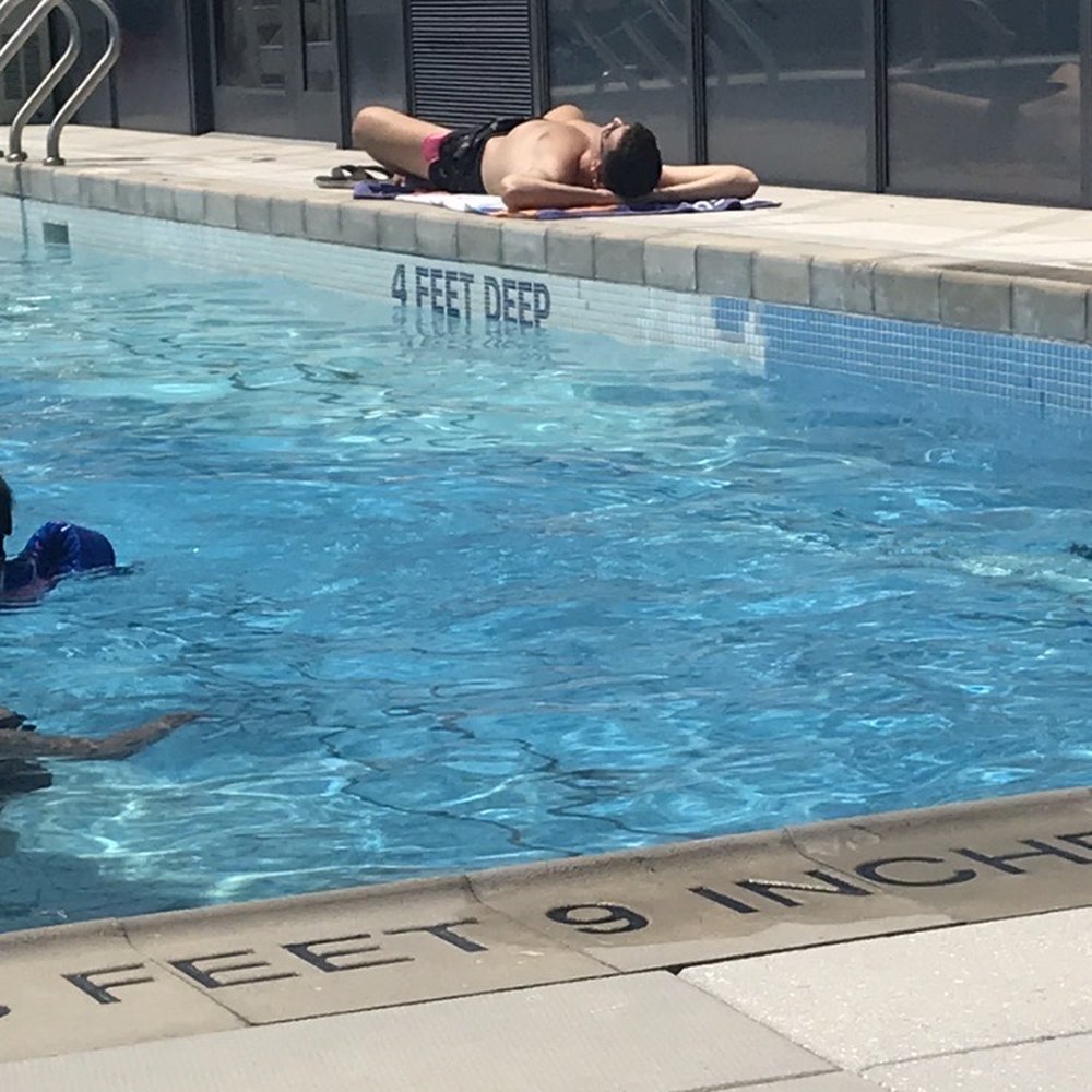 BKLYN AIR - Poor resident laying on scorching hot concrete because randos and friends of residents took all the chairs. - Commercial Real Estate Near Me - Brooklyn, New York