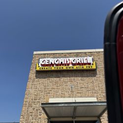 Genghis Grill - Front sign on building