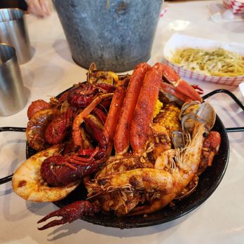 Cap't Loui - 2 lb seafood boil Garlic noodles in the back - Seafood Near Me - Cupertino, California Cap't Loui - 2 lb seafood boil Garlic noodles in the back - Seafood Near Me - Cupertino, California