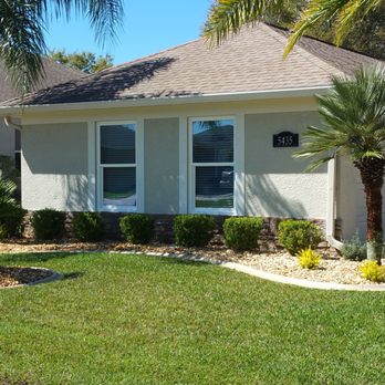 Hildreth Sod & Landscape - a palm tree in front of a house - Landscaping Near Me - Spring Hill, Florida