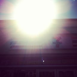 the sun shining over a building