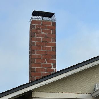 NC Roofing Solution - Old chimney with a new chimney seal mesh installed (back view). - Roofing Near Me - Walnut Creek, California