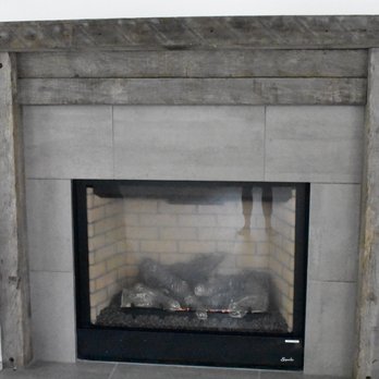 Webb Construction - a fireplace with a fire in it - General Contractors Near Me - Bluffton, South Carolina Webb Construction - a fireplace with a fire in it - General Contractors Near Me - Bluffton, South Carolina