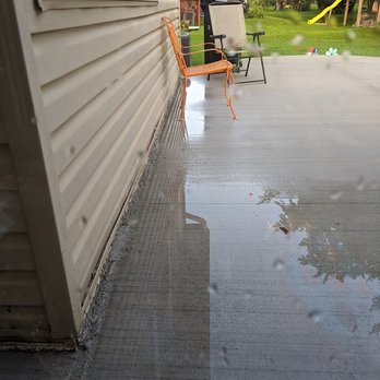 Integrity Construction & Concrete - Water puddling along house. Taken a day after rain - General Contractors Near Me - Harrison Twp, Michigan Integrity Construction & Concrete - Water puddling along house. Taken a day after rain - General Contractors Near Me - Harrison Twp, Michigan
