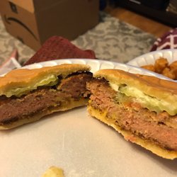 Joe's Sandwich Shop - This is what their idea of a cooked burger is. The rotten tooth manager lady tried to argue with the customer saying it was seasoning.