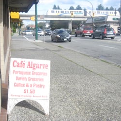 Cafe Algarve - Not a good photo, but you get the idea:  the cafe, Commercial Drive (crossing), and the rapid transit on its trestle beyond.