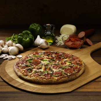 New Orleans Pizza - a pizza on a cutting board - Pizza Near Me - Owen Sound, Ontario New Orleans Pizza - a pizza on a cutting board - Pizza Near Me - Owen Sound, Ontario