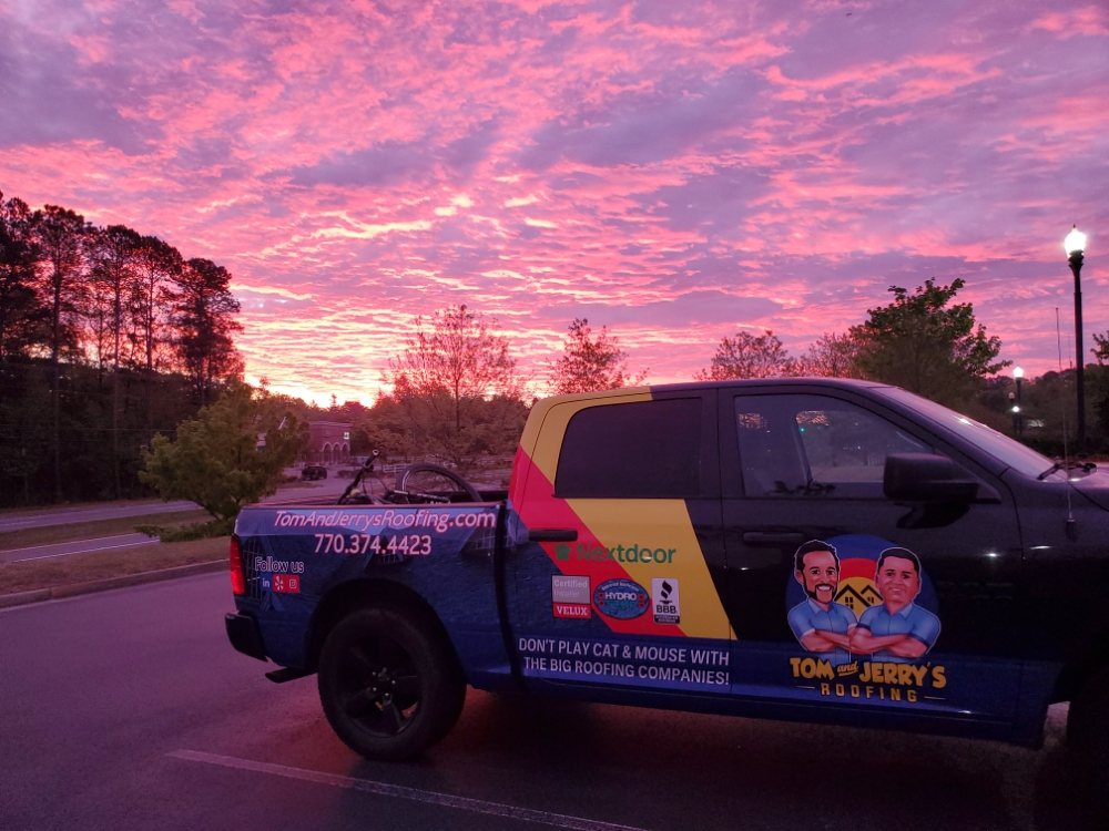 Slide of Tom and Jerry's Roofing