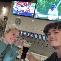 A beautiful couple and some awesome beer A beautiful couple and some awesome beer