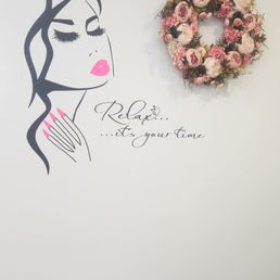 Art on the wall reminding you to relax, it's your time.