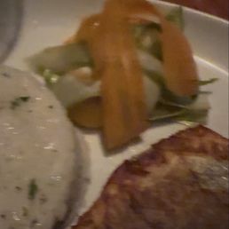 Bronzino, white rice, and veggies for garnish Bronzino, white rice, and veggies for garnish