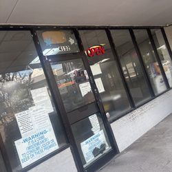 Liquor House - Open sign on, door locked