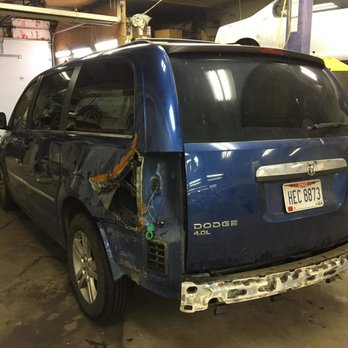 Kustom Kolors Paint & Collision - 2010 Dodge Gran Caravan before the repair - Body Shops Near Me - Cleveland, Ohio