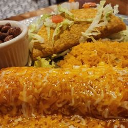 Frida's Mexican Kitchen & Bar - Combination chicken enchilada and hard shelled beef taco with whole pinto beans.