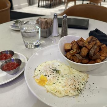 Xhibit Studio Kitchen & Bar - a bowl of fried eggs, potatoes and ketchup - Bars Near Me - Atlanta, Georgia Xhibit Studio Kitchen & Bar - a bowl of fried eggs, potatoes and ketchup - Bars Near Me - Atlanta, Georgia
