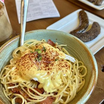 Tiramisu Bistro - Eggs benny spaghetti with elk sausage on the side - Italian Near Me - Edmonton, Alberta