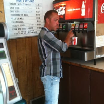 Los Juan Mexican Restaurant - a man standing at a soda machine - Mexican Near Me - Moroni, Utah Los Juan Mexican Restaurant - a man standing at a soda machine - Mexican Near Me - Moroni, Utah