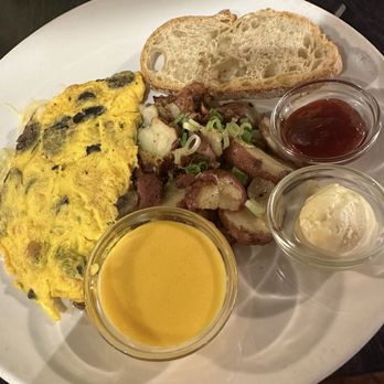 Simple Cafe - Mushroom omelette with a side of hollandaise sauce. - Breakfast & Brunch Near Me - Lake Geneva, Wisconsin Simple Cafe - Mushroom omelette with a side of hollandaise sauce. - Breakfast & Brunch Near Me - Lake Geneva, Wisconsin