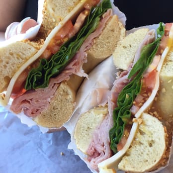 Bruegger's Bagels - Ham and Munster cheese, with lettuce and tomato Parmesan garlic bagel - Bagels Near Me - Rochester, New York Bruegger's Bagels - Ham and Munster cheese, with lettuce and tomato Parmesan garlic bagel - Bagels Near Me - Rochester, New York