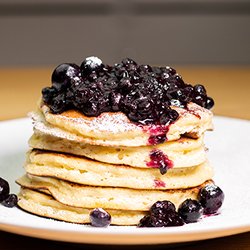 Taste Community Restaurant - Lemon Blueberry Ricotta Pancakes
House-made lemon and ricotta pancakes, topped with blueberry compote and fresh berries.