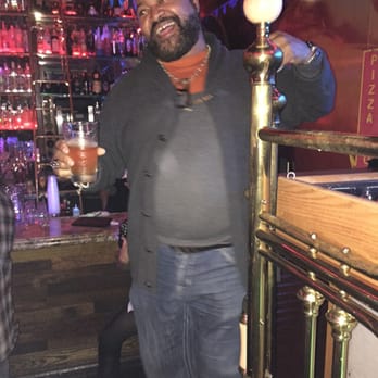 Scarlet's Saloon - a man holding a beer - Bars Near Me - Folsom, California