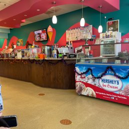 a woman standing in front of a counter