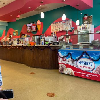Yogurt Breeze - a woman standing in front of a counter - Ice Cream & Frozen Yogurt Near Me - Orlando, Florida