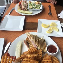 Delicious waffle fries, cubano sandwich and lobster roll with Caesar salad Delicious waffle fries, cubano sandwich and lobster roll with Caesar salad