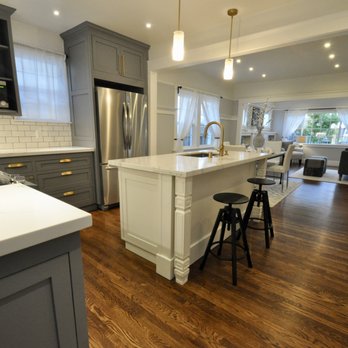 Ghirardelli Construction - a kitchen with a large island - General Contractors Near Me
