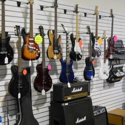 Money Mart Pawn & Jewelry - Check out the great selection of guitars and musical instruments.
