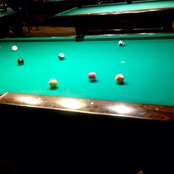 Fantasia Billiards - Best part of this place... Shooting pool!  I totally won this game (I'm the solids) - Pool Halls Near Me - Burbank, California