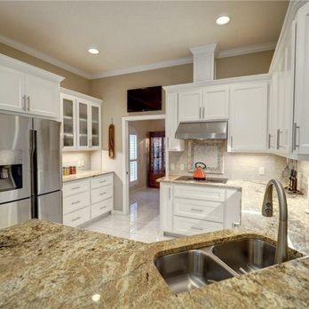 Innovo - a kitchen with granite countertops and white cabinets - General Contractors Near Me Innovo - a kitchen with granite countertops and white cabinets - General Contractors Near Me