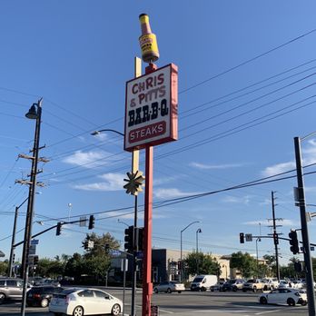 Chris' & Pitt's -  street corner with cars and traffic - Barbeque Near Me - Downey, California