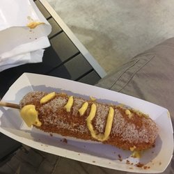 Seoul Dog rolled in sugar and topped with cheese