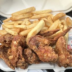 Royal Carryout - I asked for 4 wings and fries. They gave me 5 because the wings are so tiny