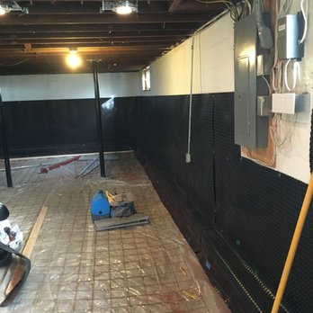 Basement Seepage Solution - Vapor barrier and wire mesh installed prior to pouring new floor - Waterproofing Near Me - Yorkville, Illinois