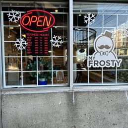 Exterior outside entrance of My Frosty - Window with restaurant hours - Vancouver, British Columbia Exterior outside entrance of My Frosty - Window with restaurant hours - Vancouver, British Columbia